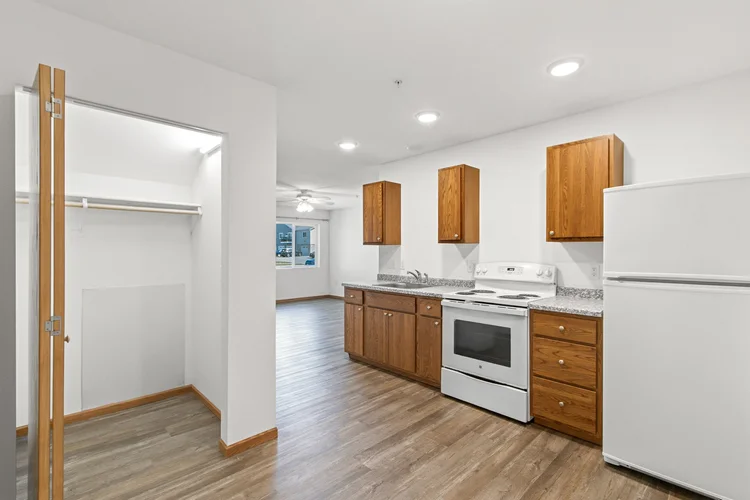 Greenfield Estates studio — closet, kitchen and main room