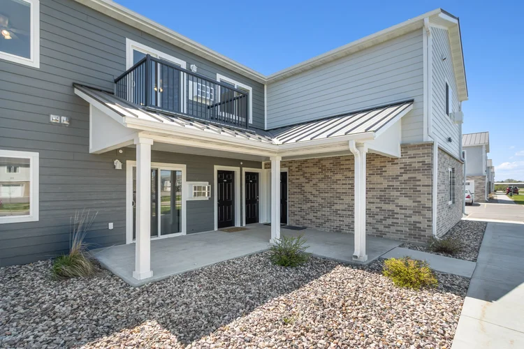 Greenfield Estates 3 bedroom upper — covered patio entry with balcony