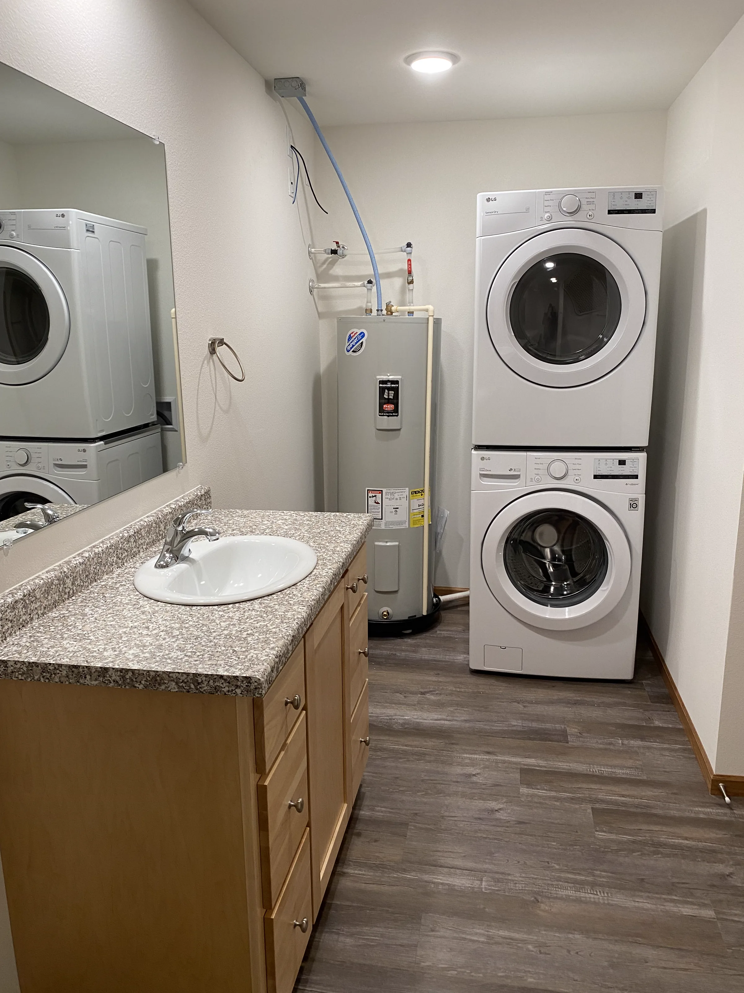 studio apartment laundry and vanity at huntington park reedsburg